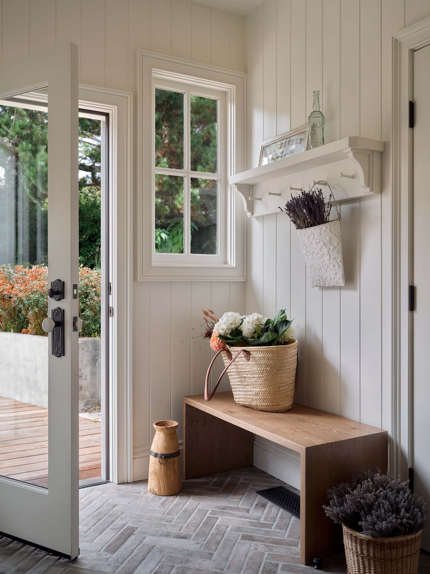 Entry Bench in Mendocino Italianate House by Atelier Julienne