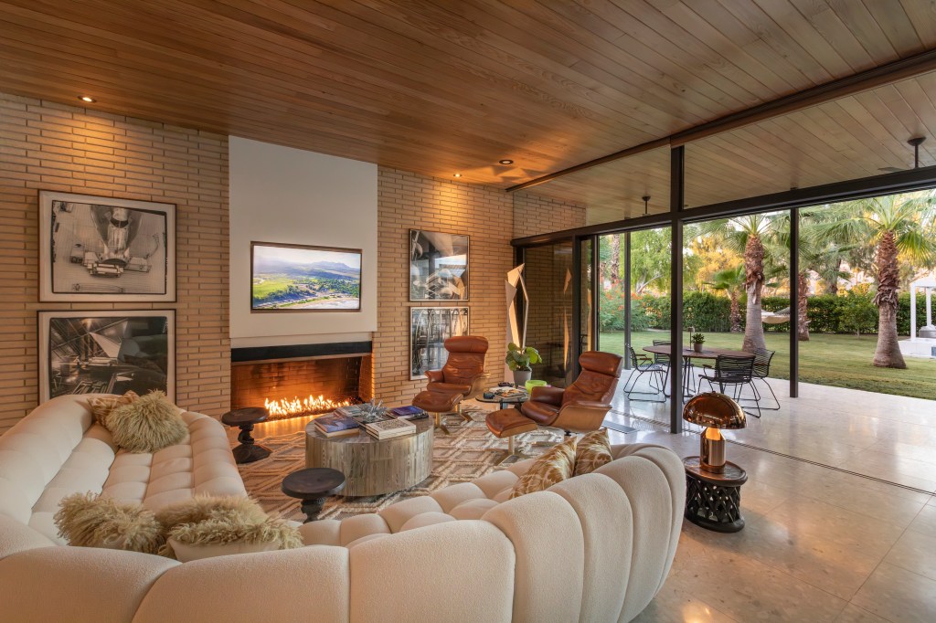 Living room with wood paneling on the ceiling