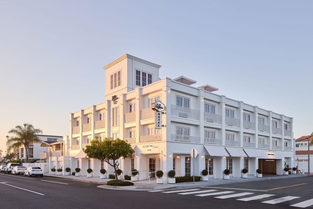 The exterior of the Bay Shores Peninsula Hotel in Newport Beach, CA