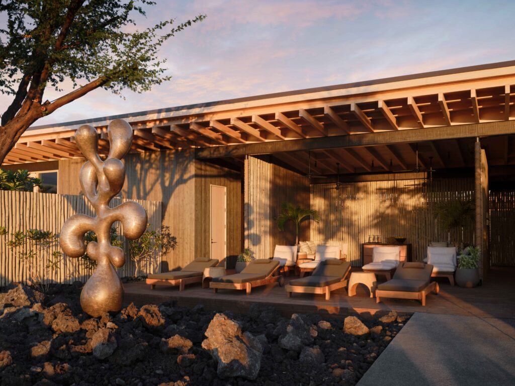 Outdoor lounge area at a spa in Hawaii, overlooking volcanic rock.