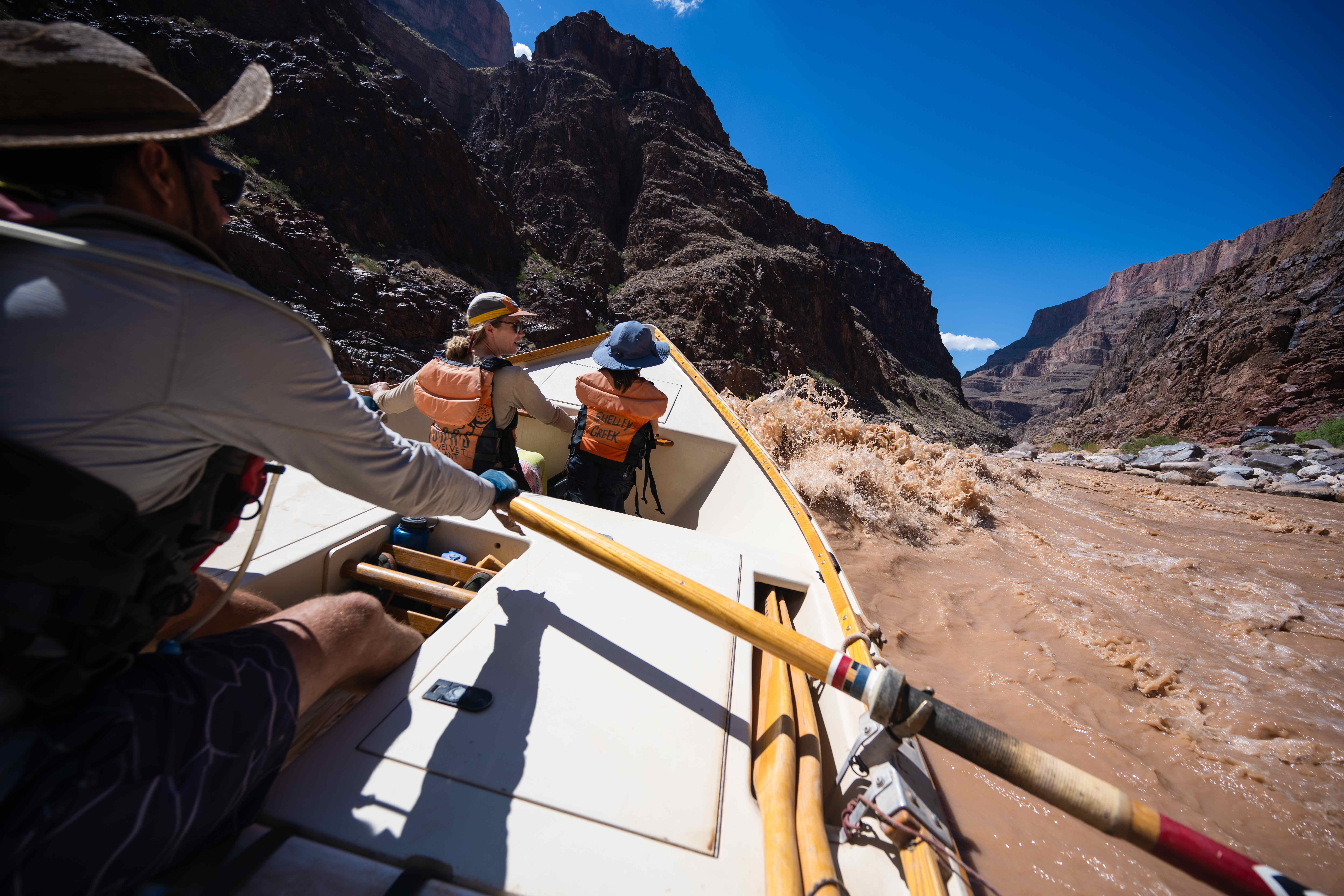 a-dory-dances-through-a-class-iii-rapid-on-the-colorado-river