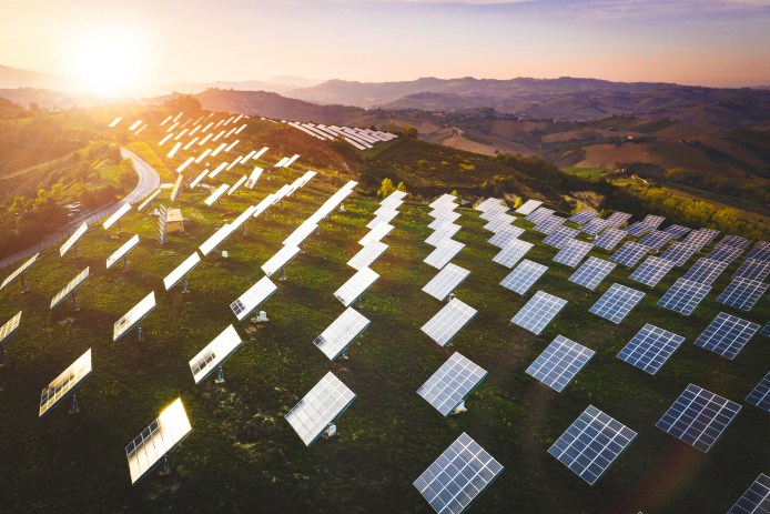 Solar panels fields on the green hills