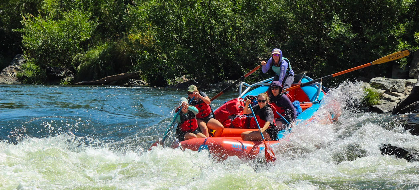 group-of-women-paddling-grave-creek-falls-on-the-rogue-river