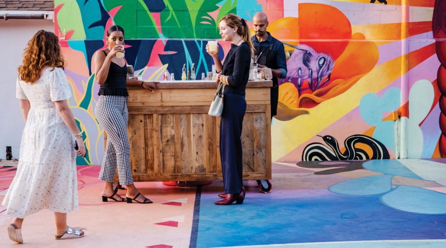 People drinking cocktails at Little City Farm LA