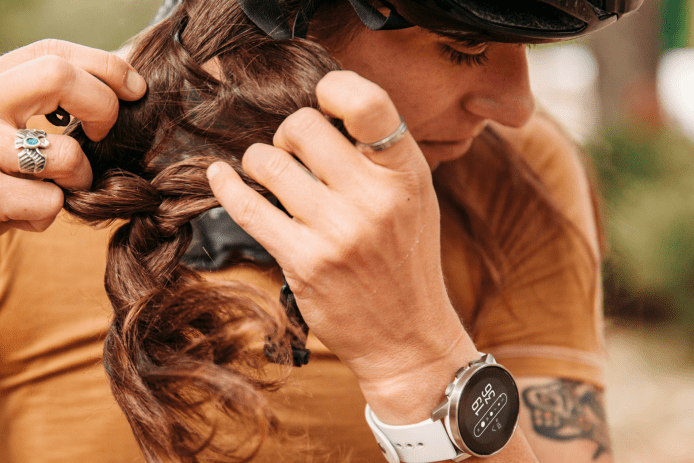 close up of person buckling bike helmet