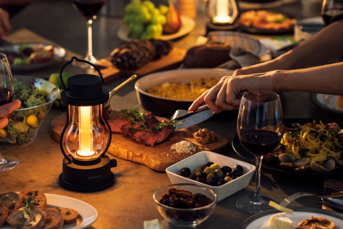 camping lantern illuminating dinner table