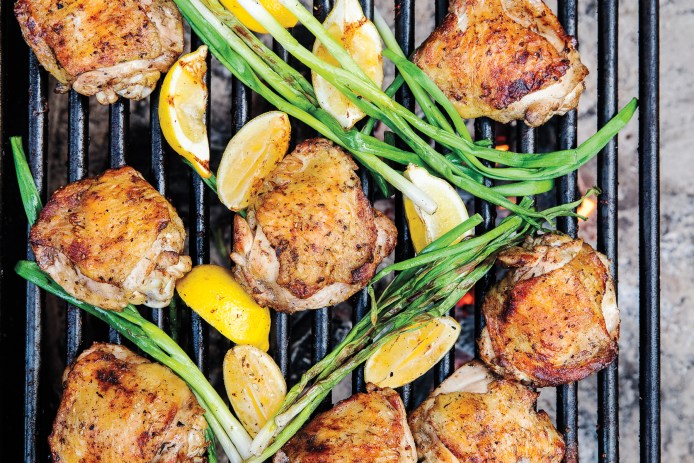 Camp chicken dinner over grill