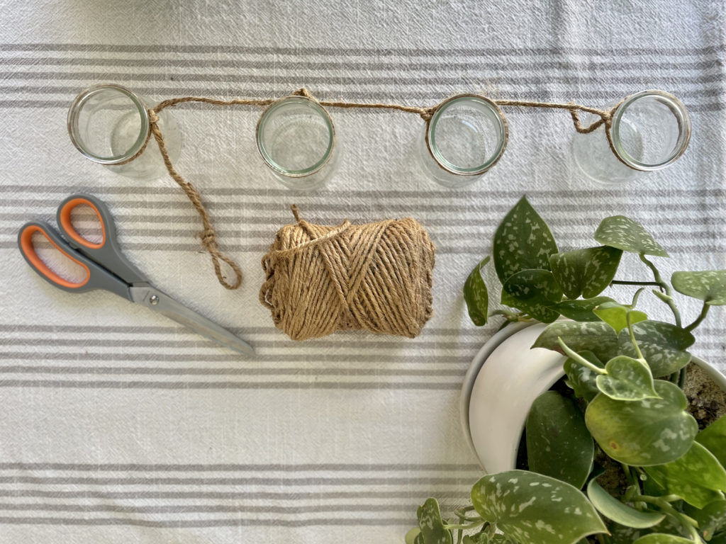 Tie knots in twine for plant propagator