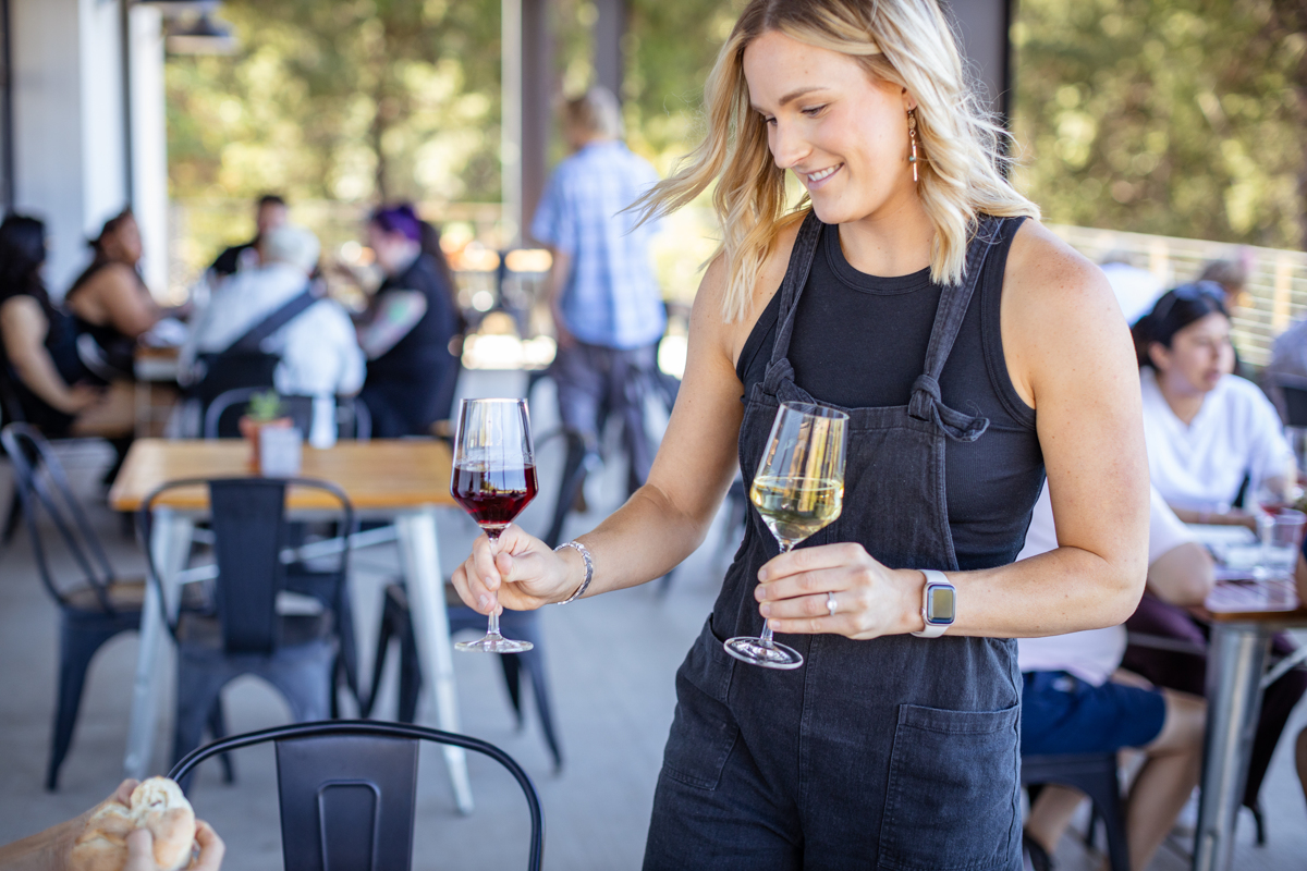 a-delfino-family-member-serving-wine