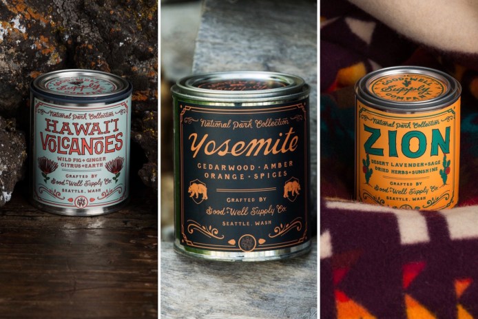 candles in tin cans positioned in front of volcanic rock, wood, and a colorful blanket
