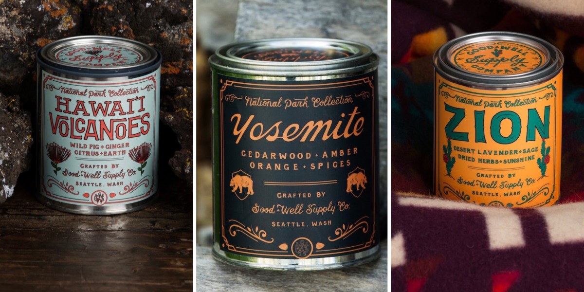 candles in tin cans positioned in front of volcanic rock, wood, and a colorful blanket
