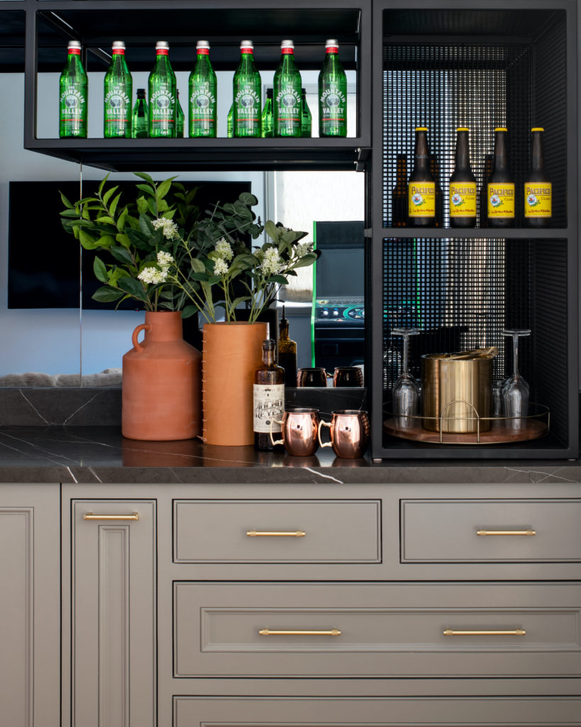 Manhattan Beach home tour by HMS Interiors bar with black marble.