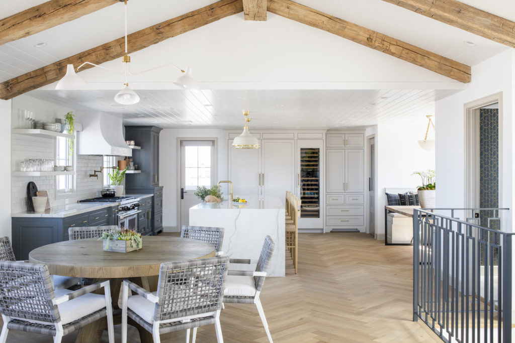 Manhattan Beach home tour by HMS Interiors upstairs kitchen with table and dining nook.