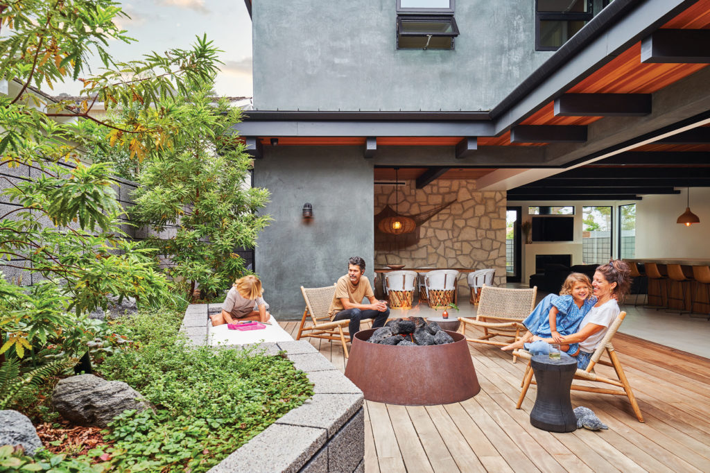 Newport Beach home Backyard deck with fire pit and indoor/outdoor space
