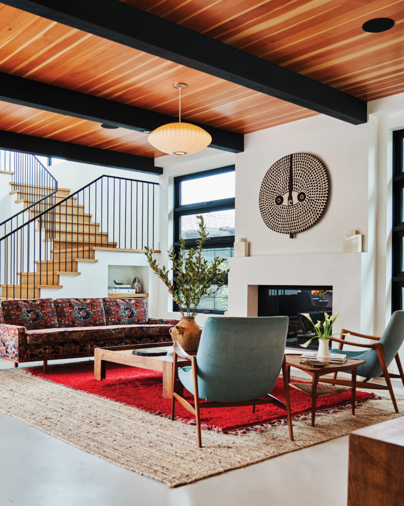 Newport Beach home - living room space with staircase, wood beams
