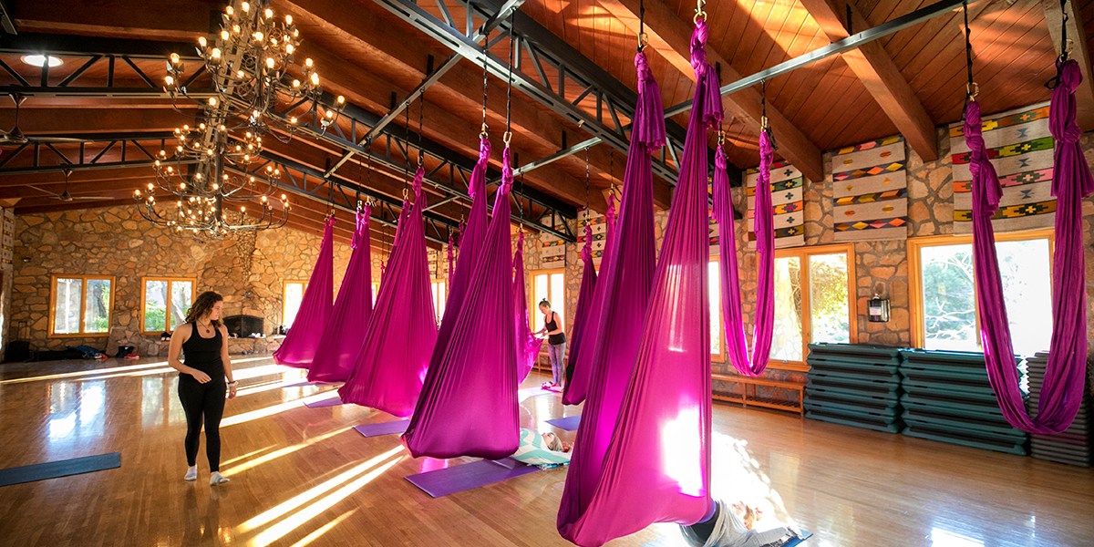 A room with aerial yoga materials.