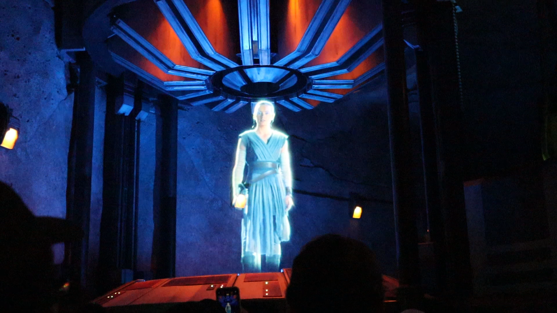 Hologram of Rey urges riders to join the Resistance.