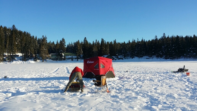 an-ice-fisher-sets-up-their-area-at-diamond-lake-resort