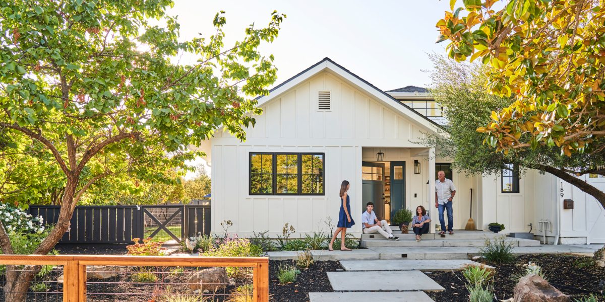 Family infront of house