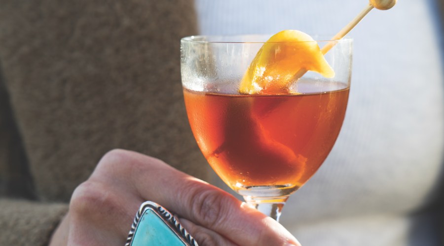 Burnt orange cocktail yellow garnish