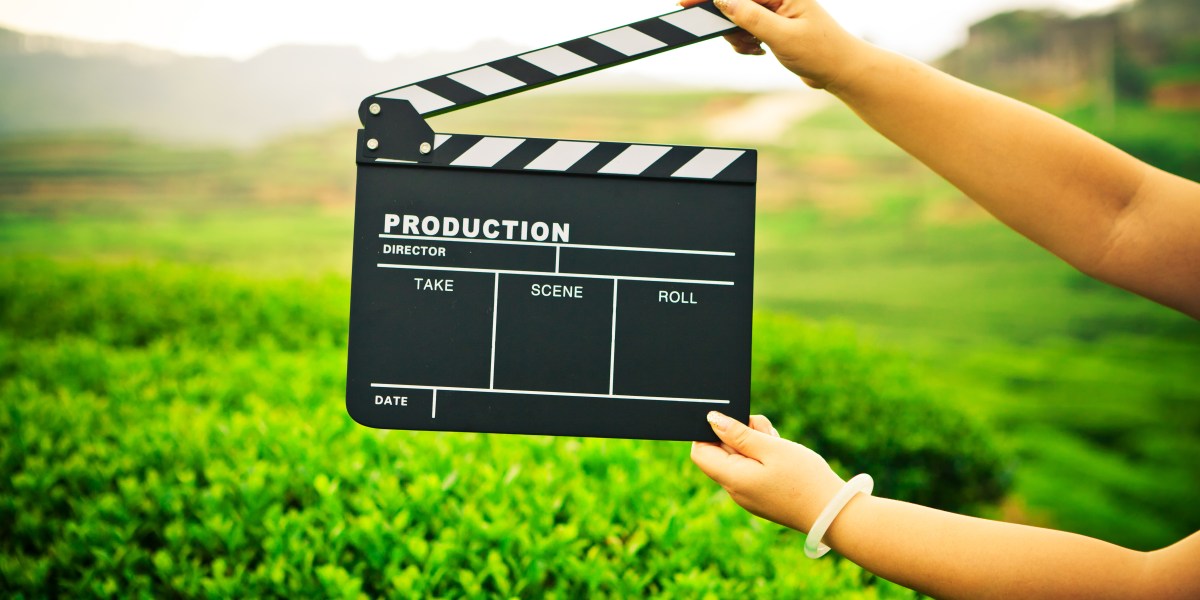 Woman with a Clapper Board