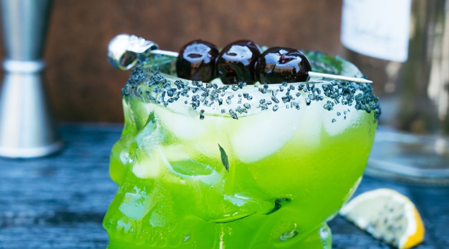Green Witches Brew Cocktail in a Skull Glass