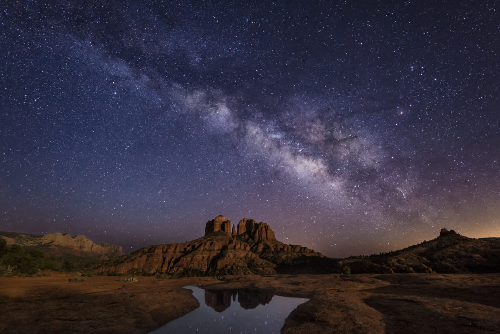 starry night sky over the red cathedral rock in sedona arizona