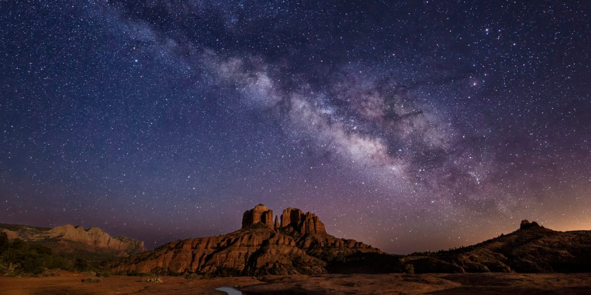 starry night sky over the red cathedral rock in sedona arizona