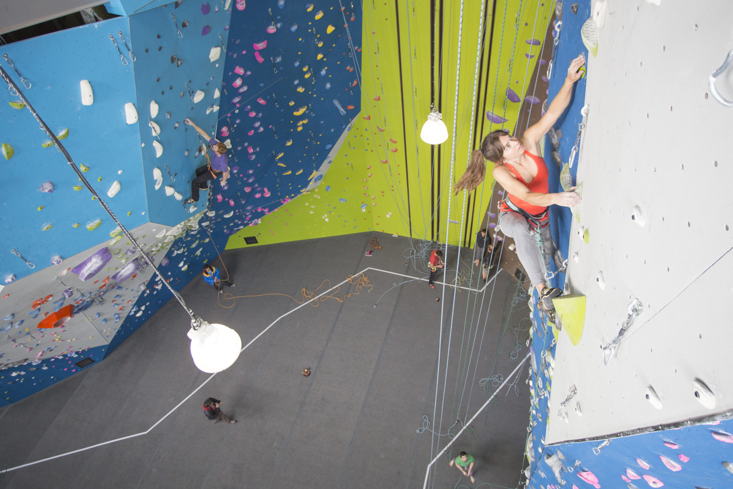 Climber scales a rock wall.