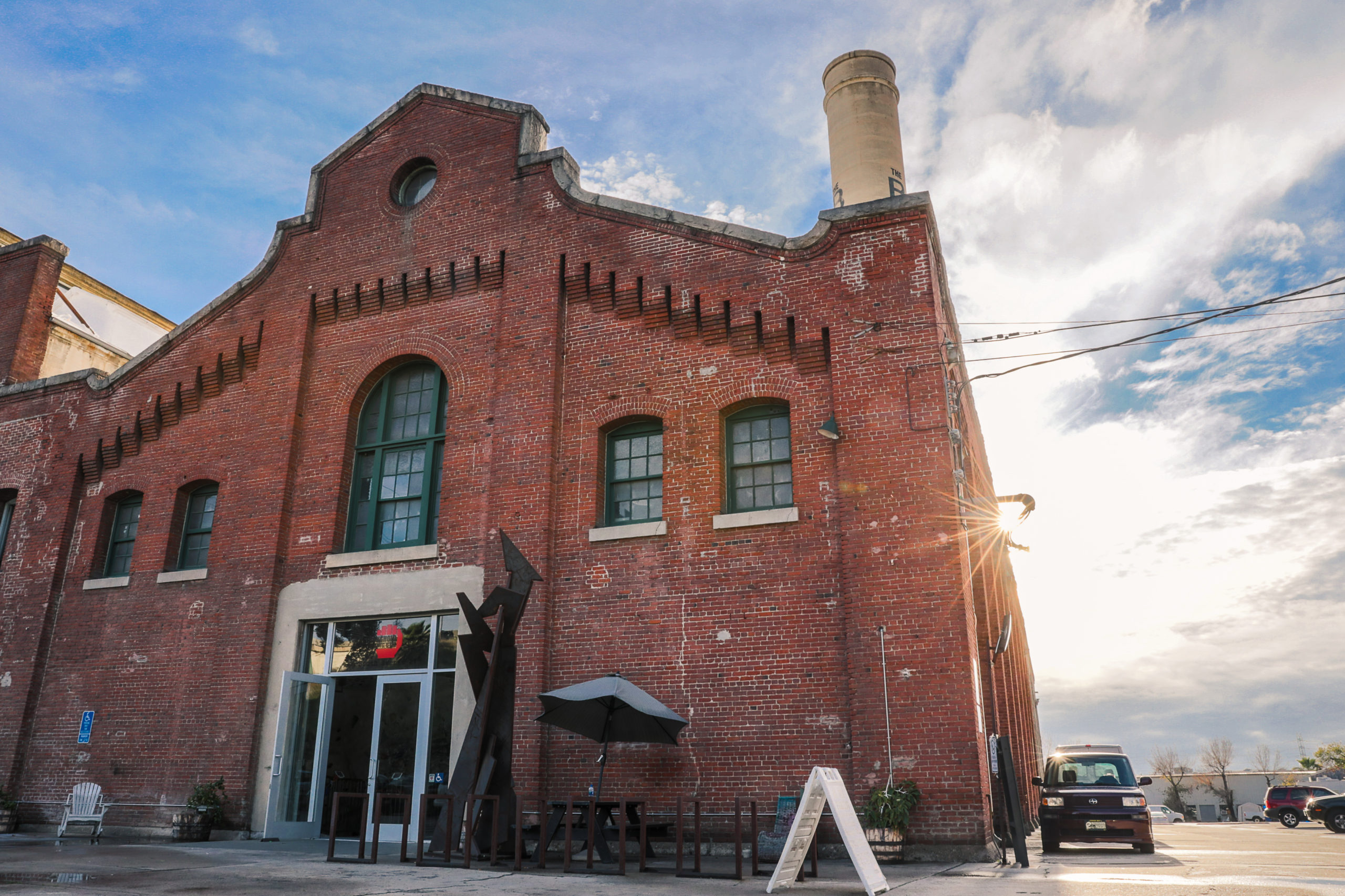 Sun peaks behind Stronghold Climbing Gym.