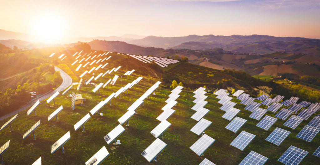 Solar panels fields on the green hills