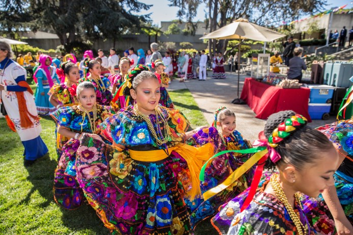 Little girls in costume lined up for performance at Day of the Dead event at the Oakland Museum of California