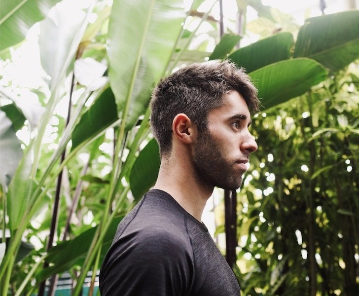 Side profile of man infront of plants