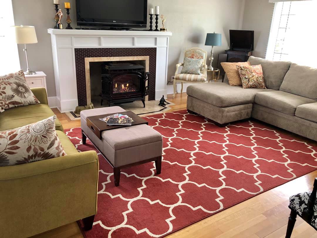 snuggle-up-in-front-of-the-fireplace-with-a-good-book-in-the-common-area