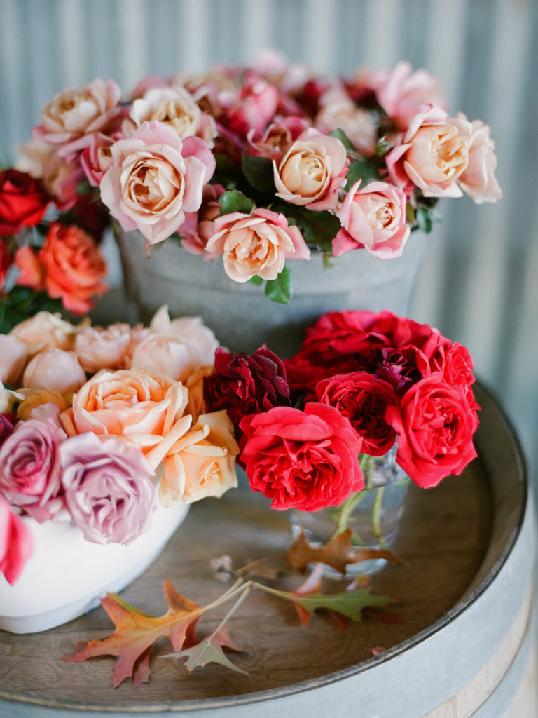 Pink and red roses in vases