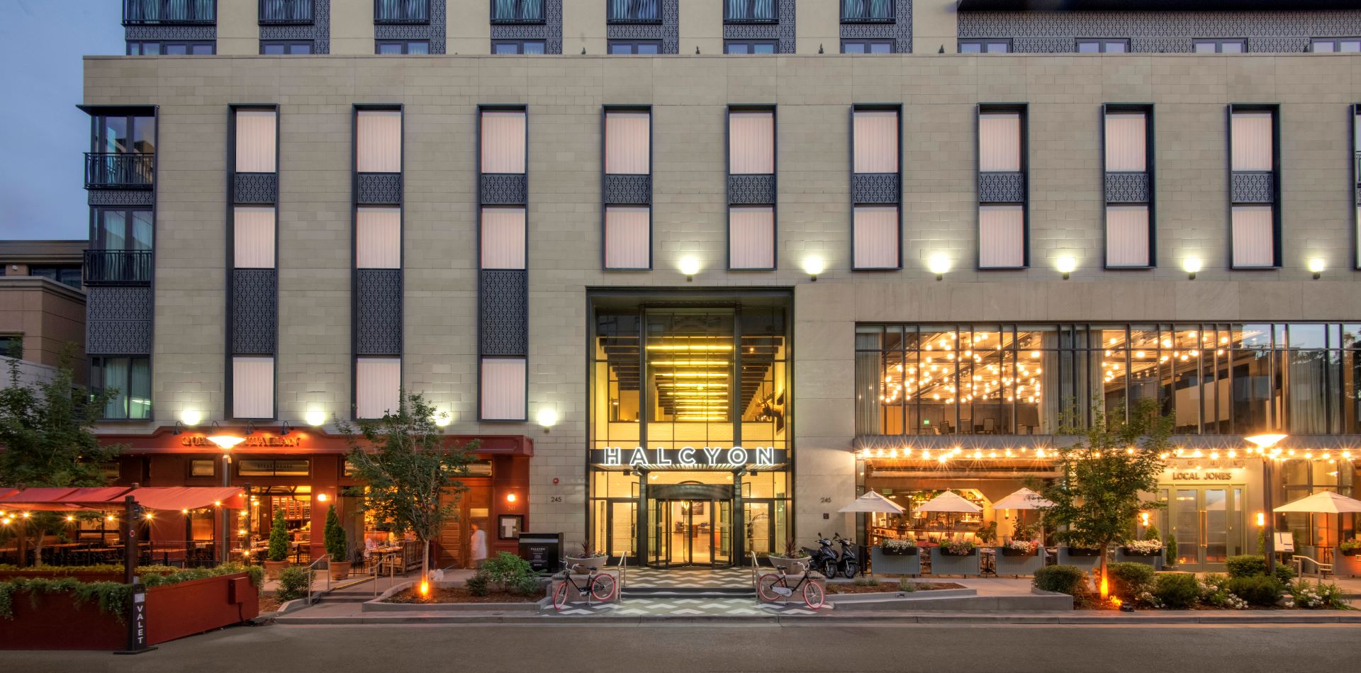 the-exterior-of-halcyon-a-hotel-in-cherry-creek-at-dusk