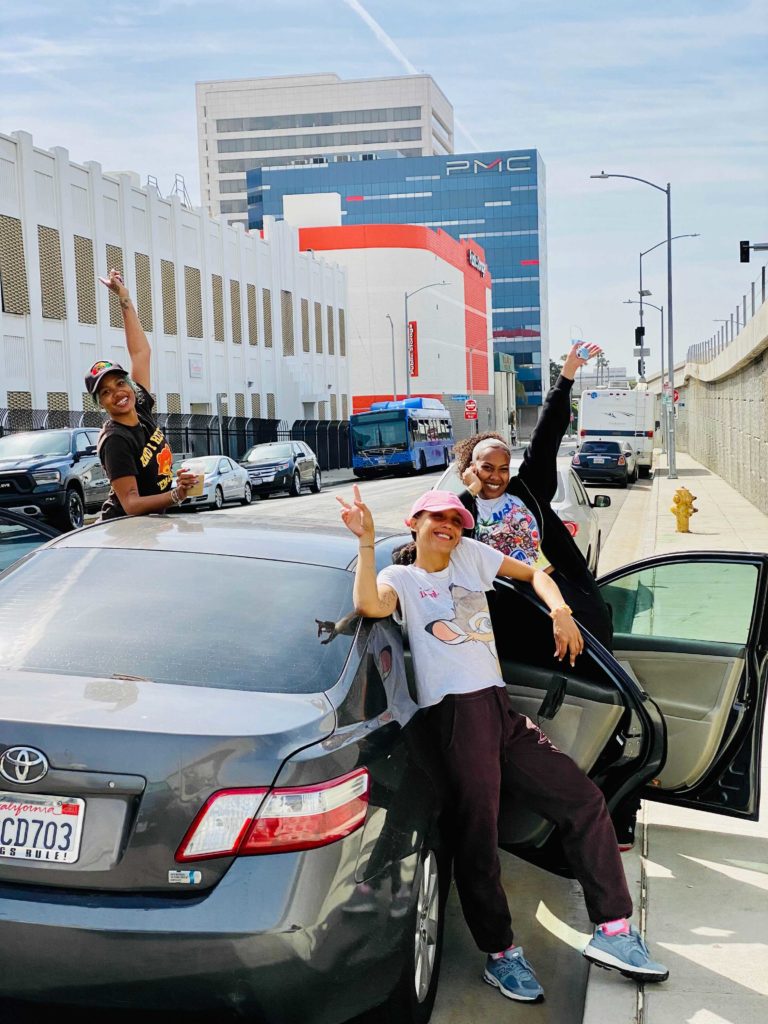 ca hilton roadtrip shot of girls on car