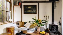 Ido Yoshimoto handmade cabin living area Inverness wood stove