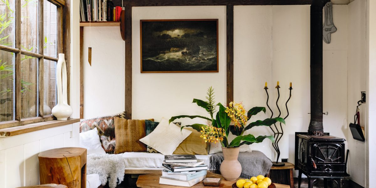 Ido Yoshimoto handmade cabin living area Inverness wood stove