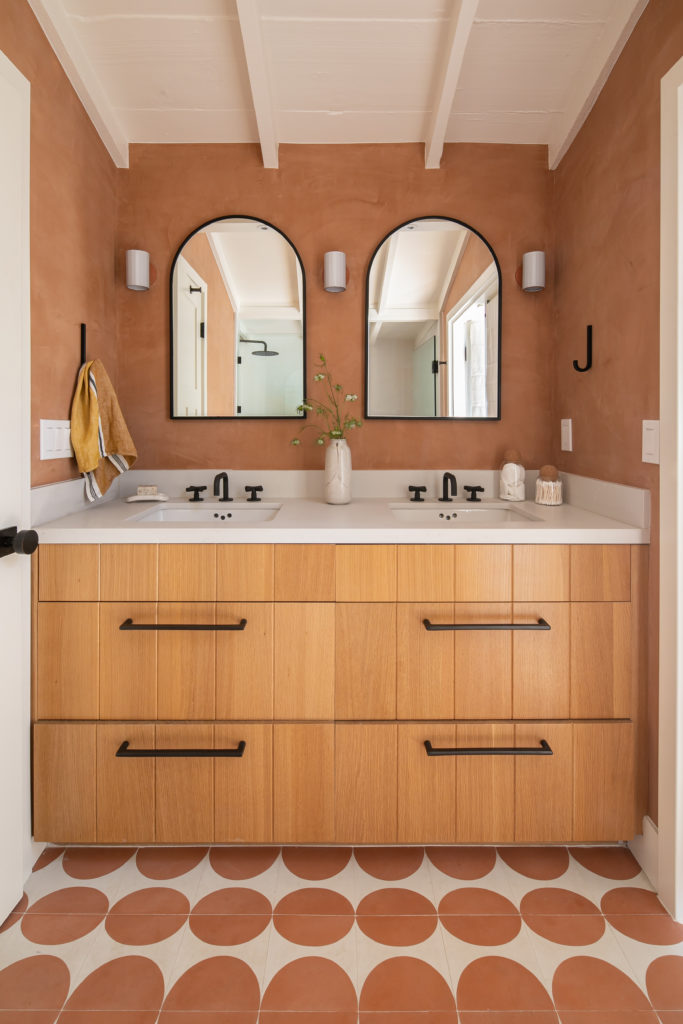 Raili Clasen Laguna Beach primary bathroom concrete tile terracotta