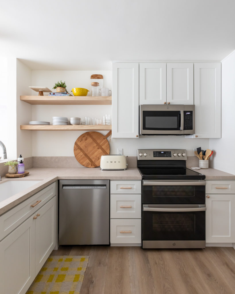 Open shelves and brass accents are easy updates to a beach condo kitchen