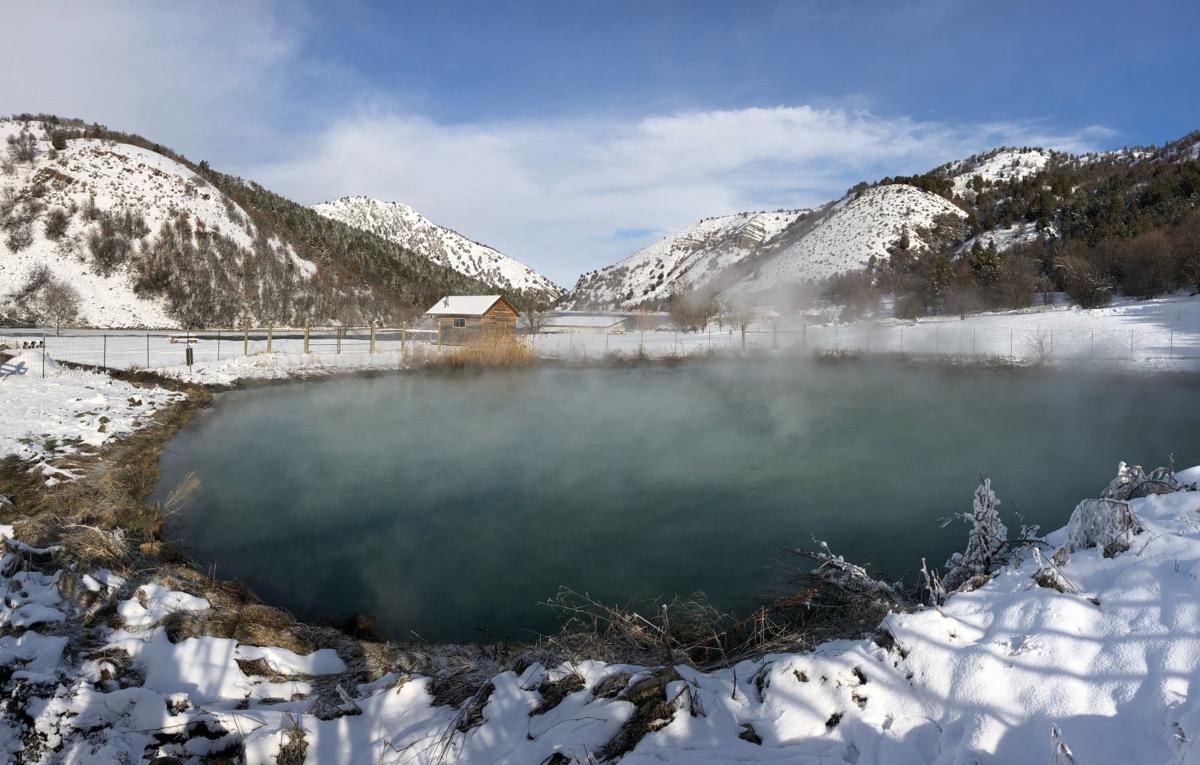 The hot springs pool surrounded by snow-covered hills at Maple Grove in Idaho