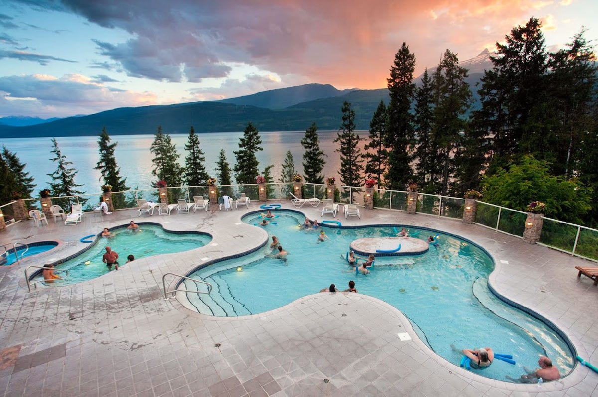 Halcyon Hot Springs pools at sunset with lake in background
