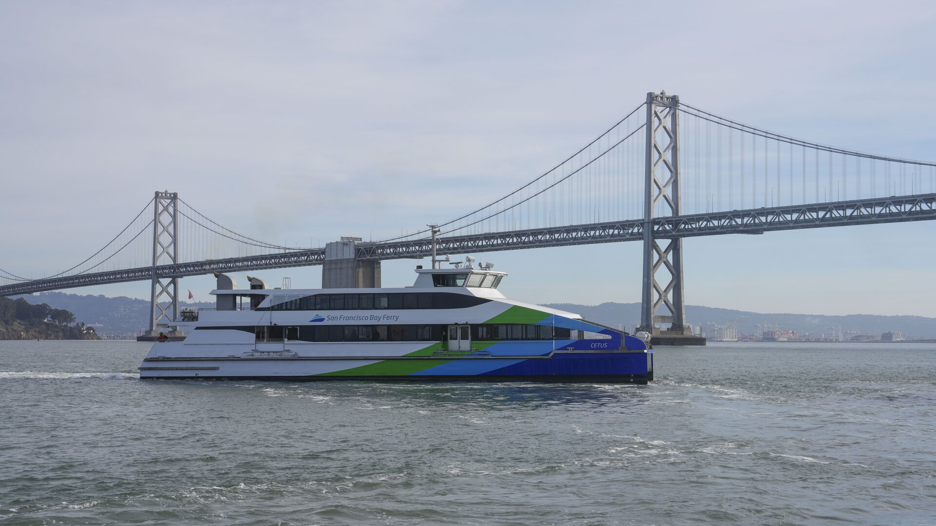 a-san-francisco-bay-ferry-vessel-transiting-in-front-of-the-bay-bridge