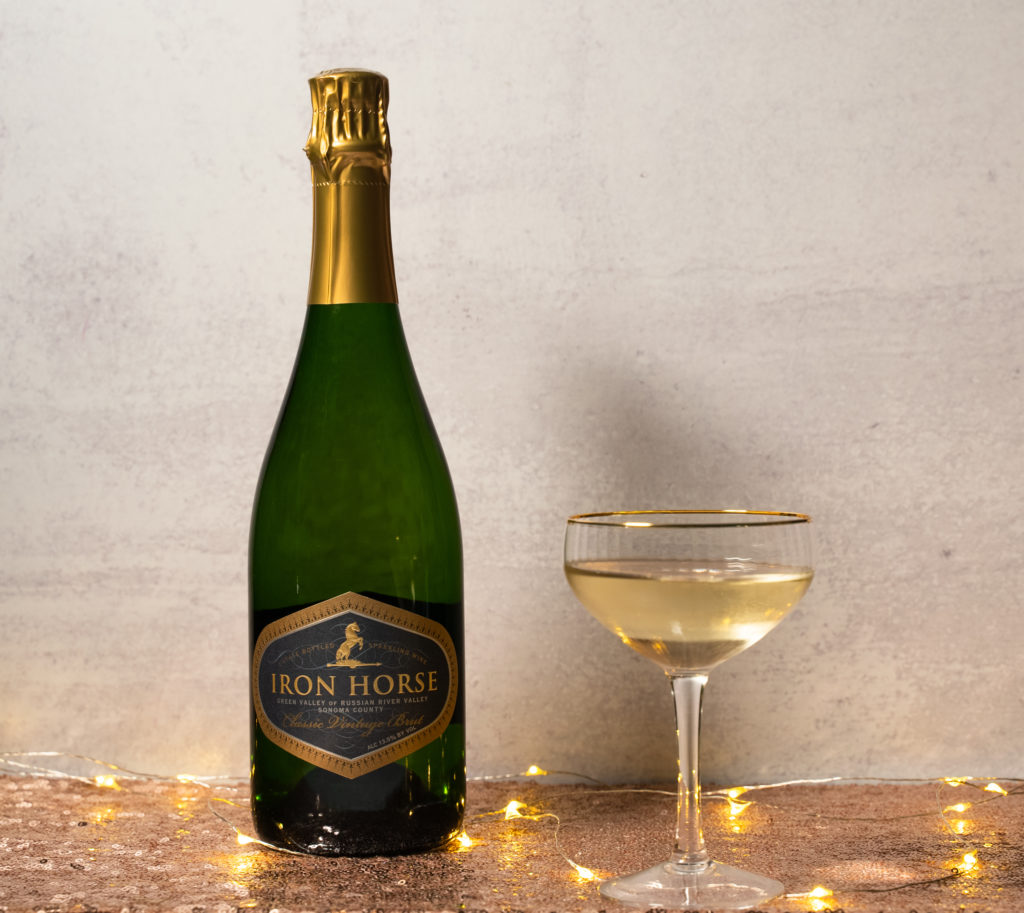 iron horse bottle with vintage champagne flute