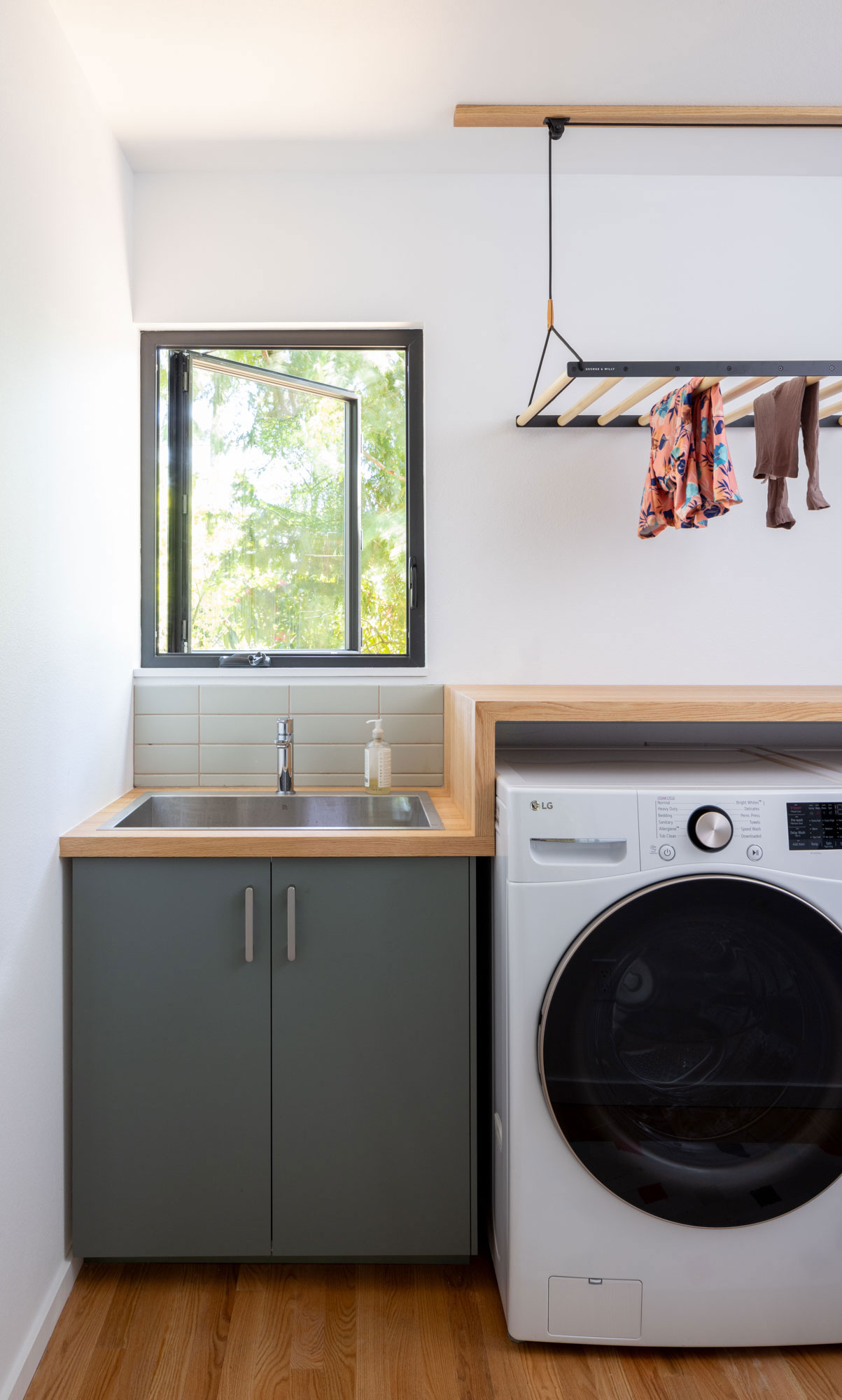 Laundry Room in Wedgewood Seattle House by Best Practice Architecture