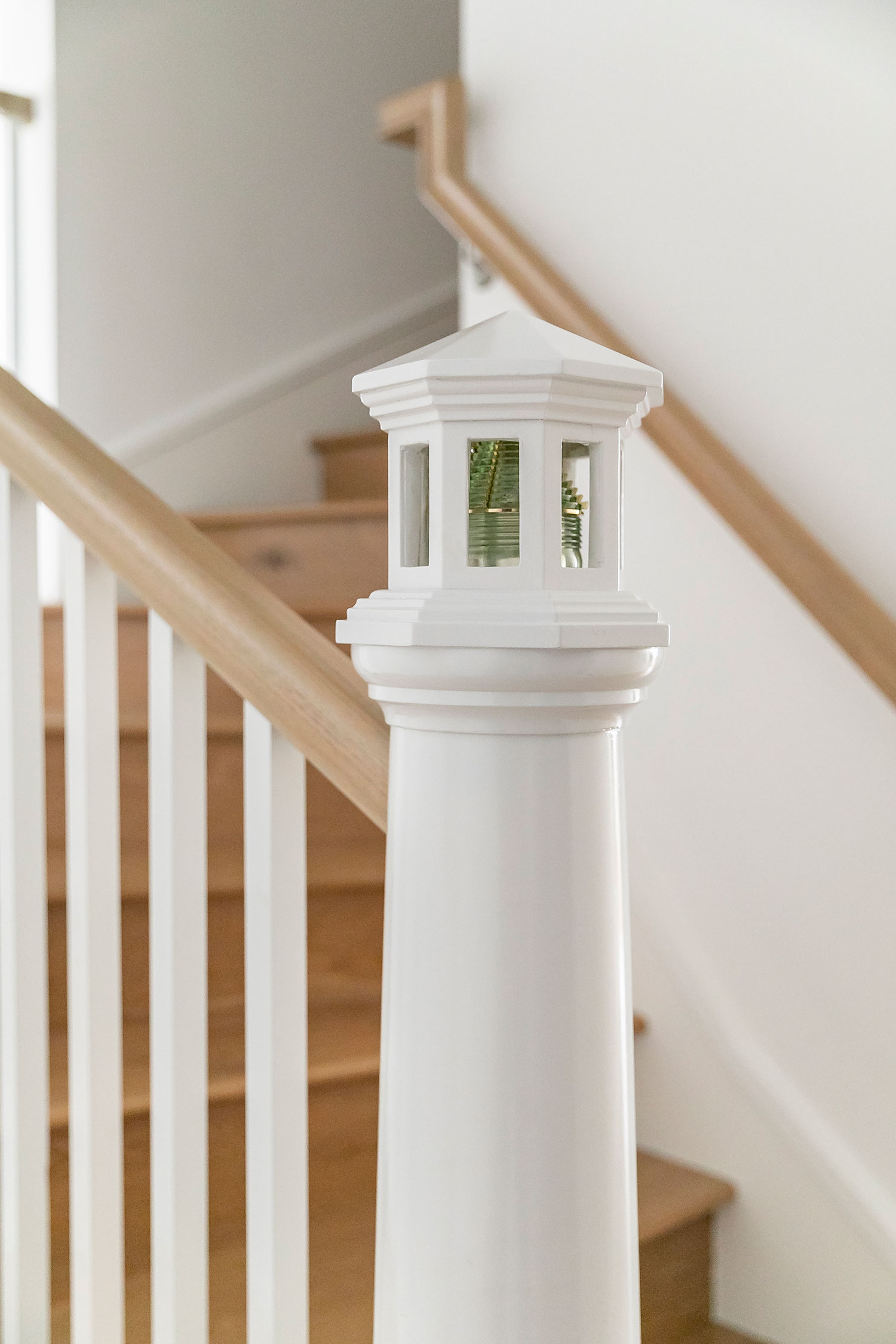 Lighthouse Stair Post in Balboa Island Cottage by Blackband Design