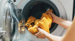 Loading Laundry Washing Machine