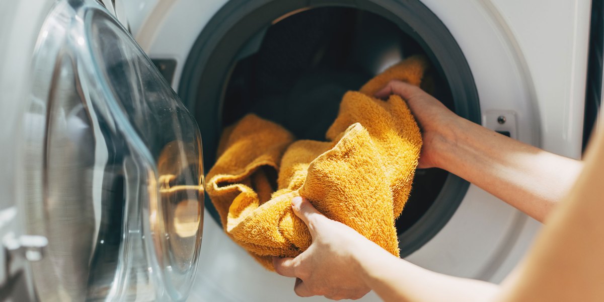 Loading Laundry Washing Machine