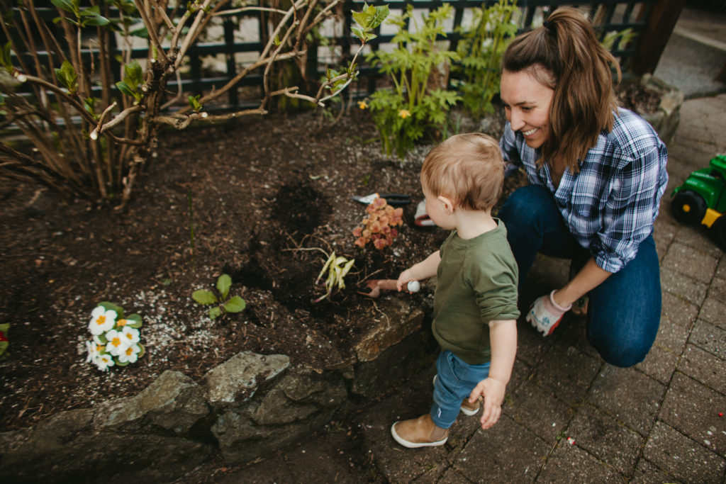 Vanessa Dawson and son Greyson digging in the garden